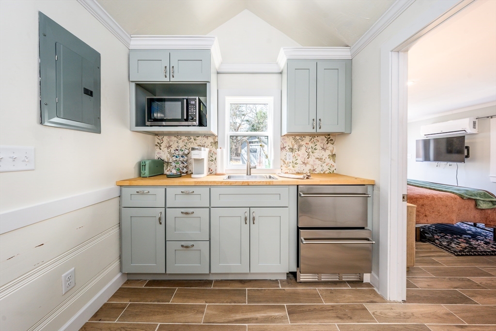 17 Ploughed Neck Road Sandwich, MA 02537 - Photo 6 of 13 a spacious bathroom with a sink and a mirror