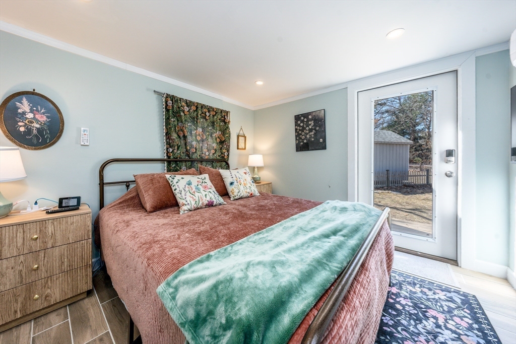 17 Ploughed Neck Road Sandwich, MA 02537 - Photo 7 of 13 a bedroom with a bed and dresser with mirror