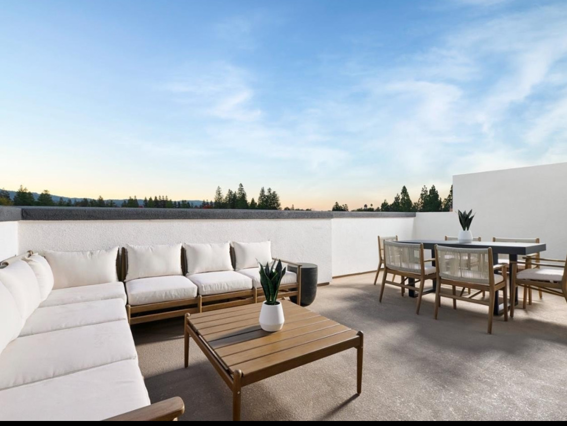 3233 Central Street Evanston, IL 60201 - Photo 12 of 12 a roof deck with couches and potted plants with sky view
