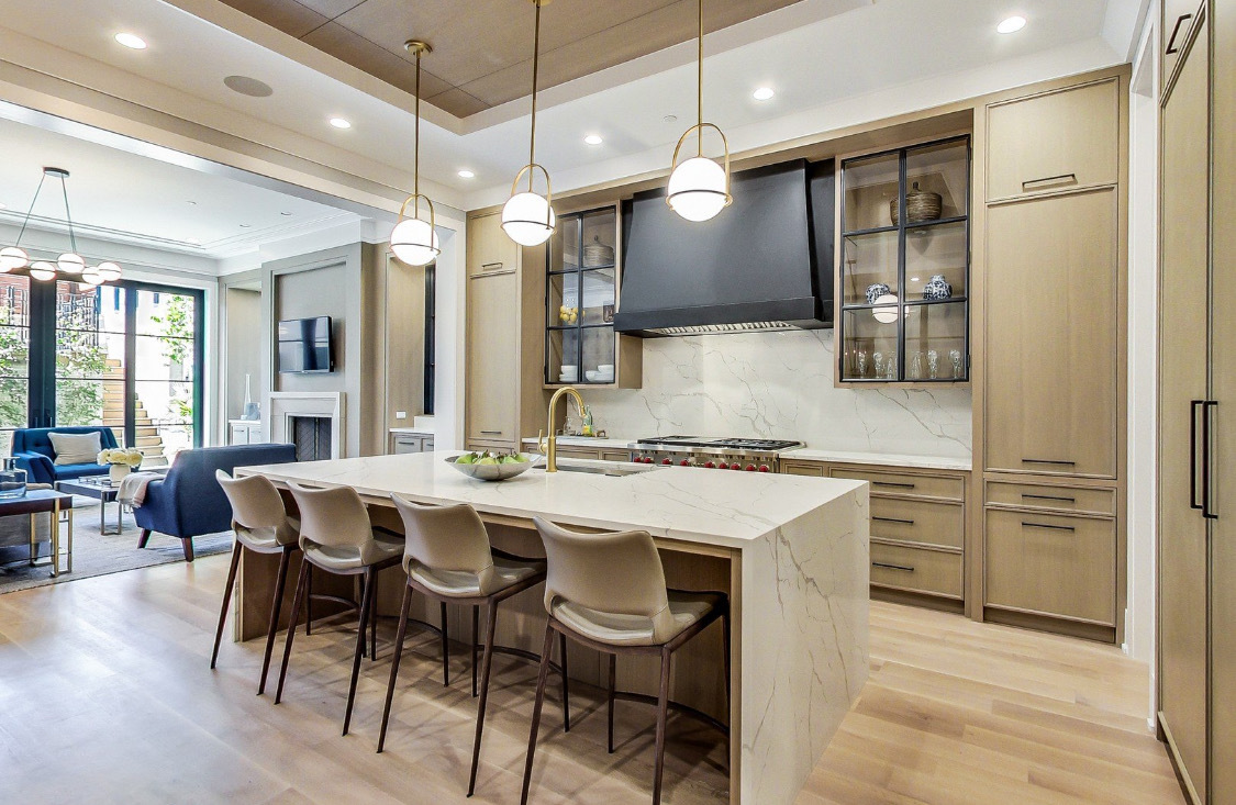 3233 Central Street Evanston, IL 60201 - Photo 4 of 12 a kitchen with a table chairs refrigerator and microwave