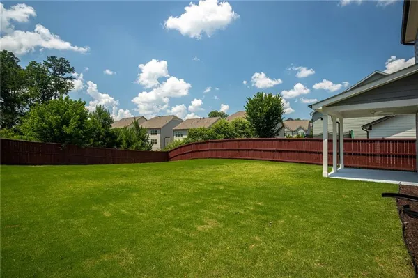 a view of a house with a big yard