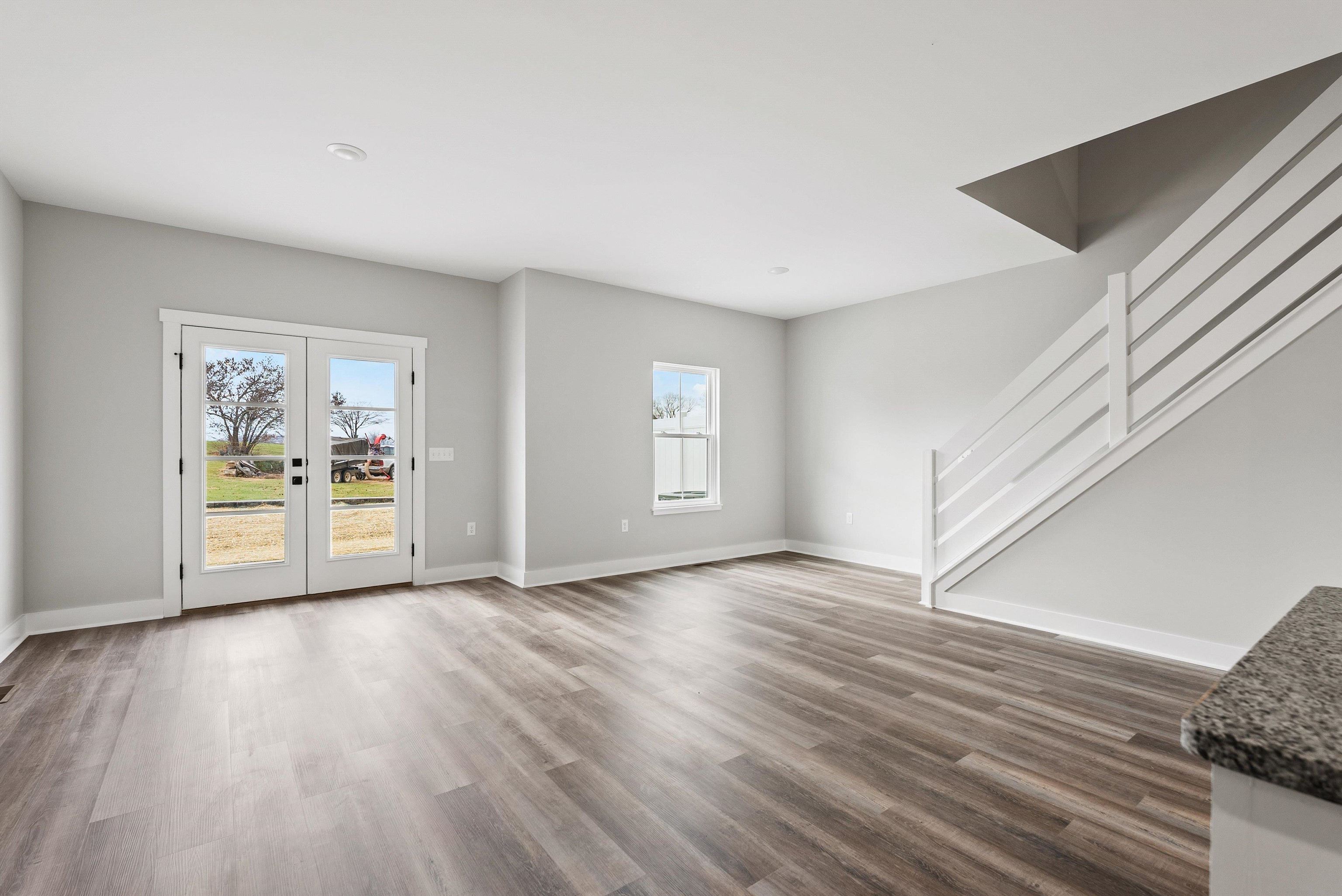 25 Barnyard Circle Bridgewater, VA 22812 - Photo 11 of 45 a view of an empty room with a window and wooden floor