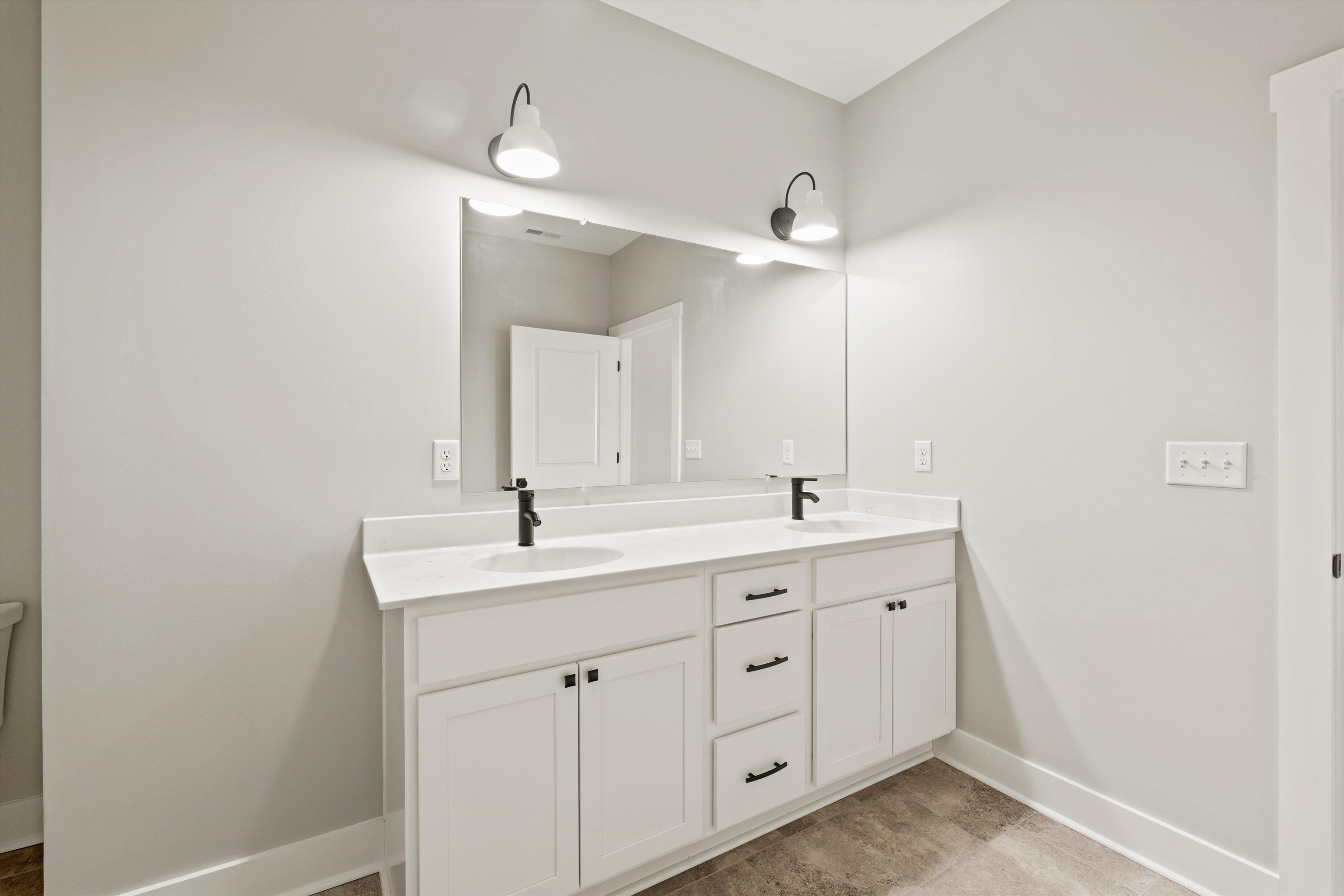 25 Barnyard Circle Bridgewater, VA 22812 - Photo 15 of 45 a bathroom with a double vanity sink and a mirror