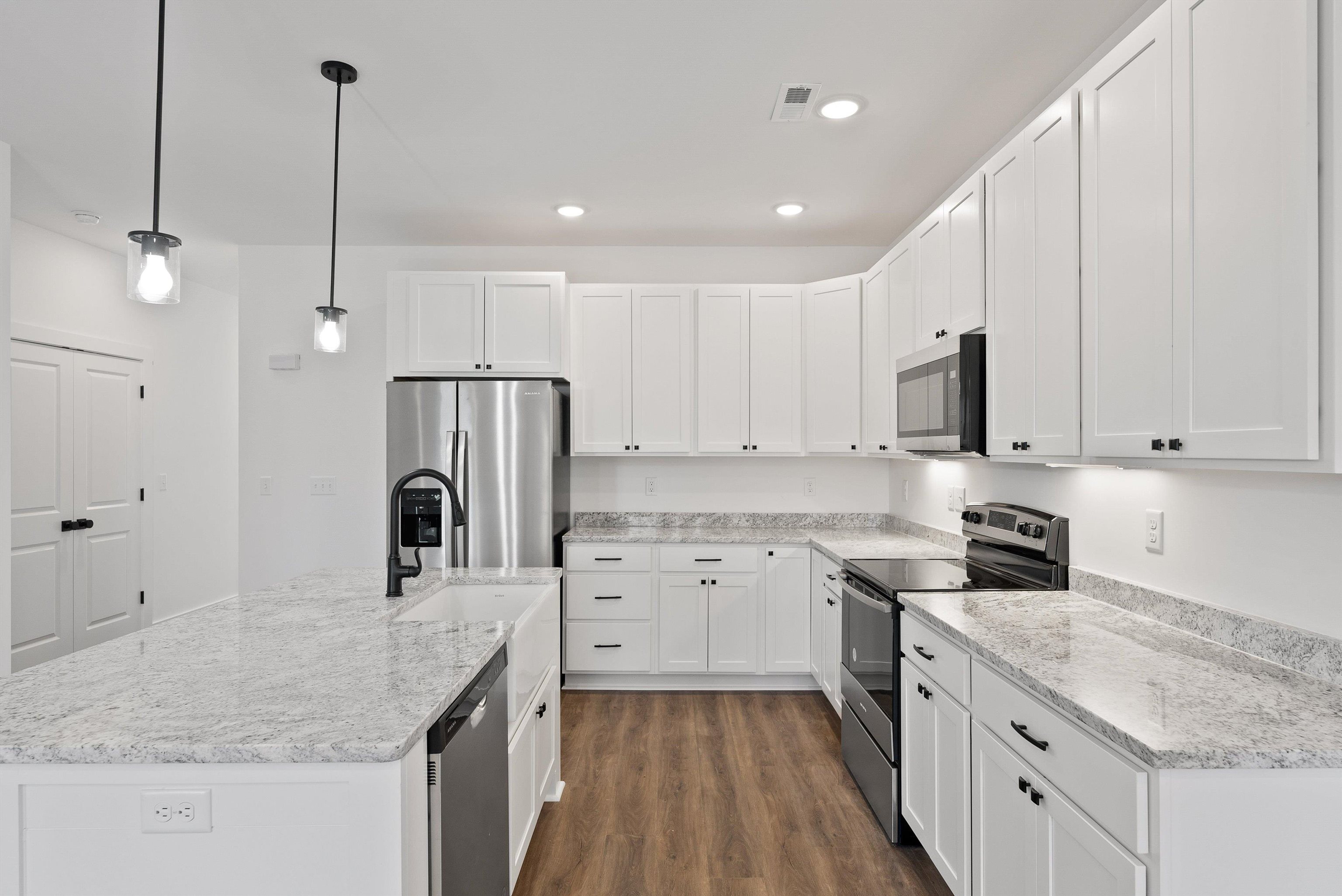25 Barnyard Circle Bridgewater, VA 22812 - Photo 29 of 45 a kitchen with granite countertop a sink a counter top space stainless steel appliances and cabinets
