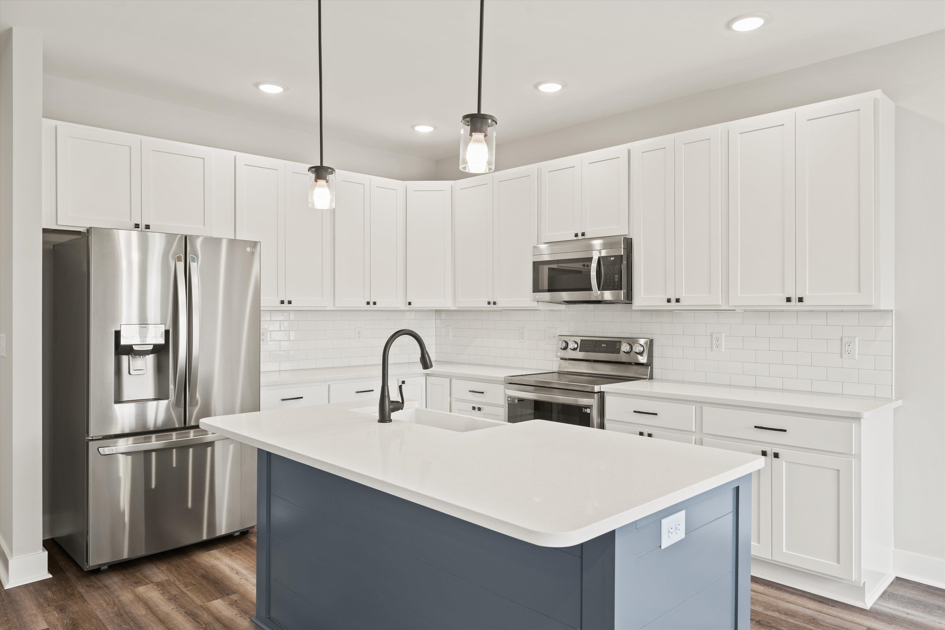 25 Barnyard Circle Bridgewater, VA 22812 - Photo 5 of 45 a kitchen with stainless steel appliances a refrigerator sink and microwave