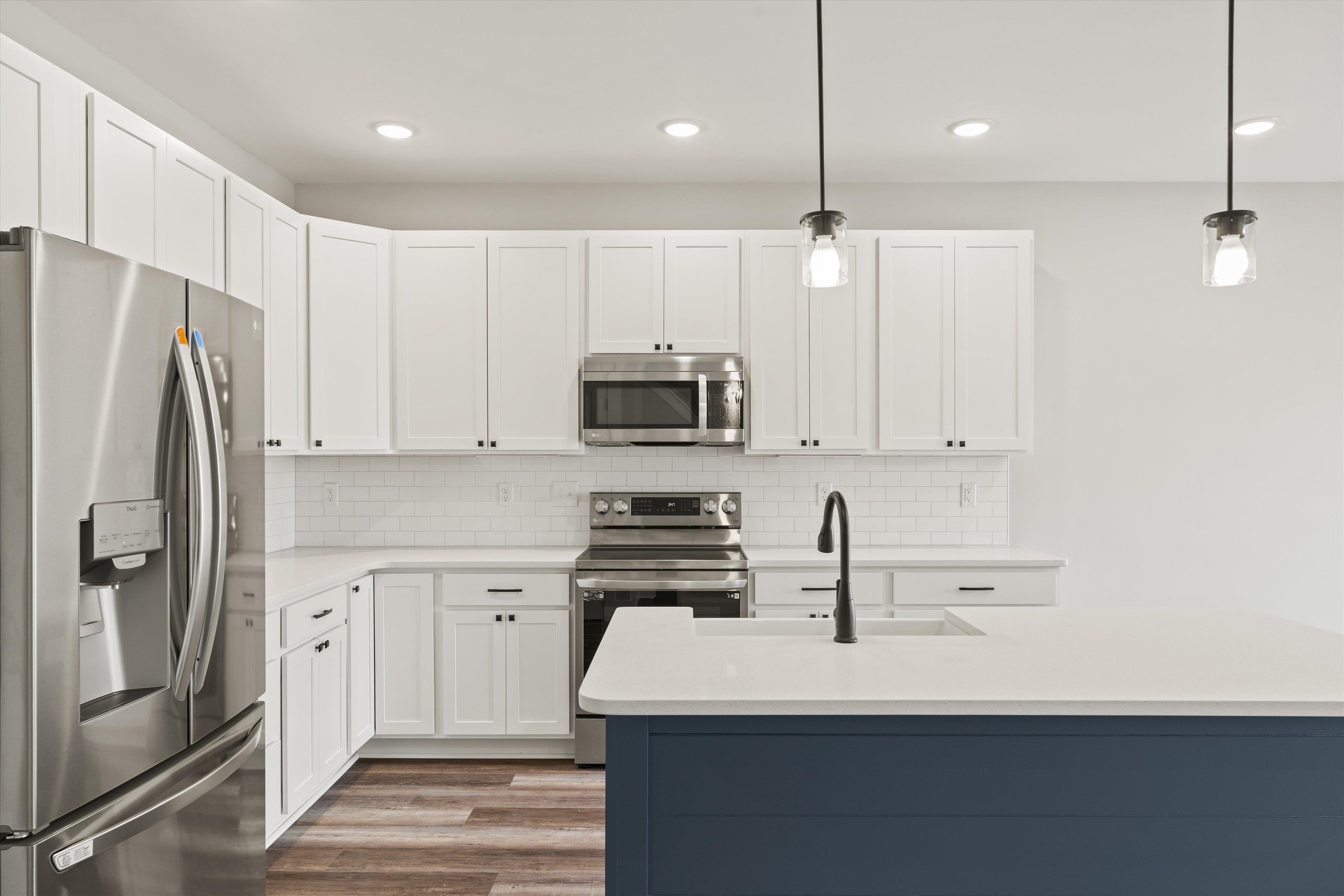 25 Barnyard Circle Bridgewater, VA 22812 - Photo 8 of 45 a kitchen with stainless steel appliances a refrigerator sink and microwave