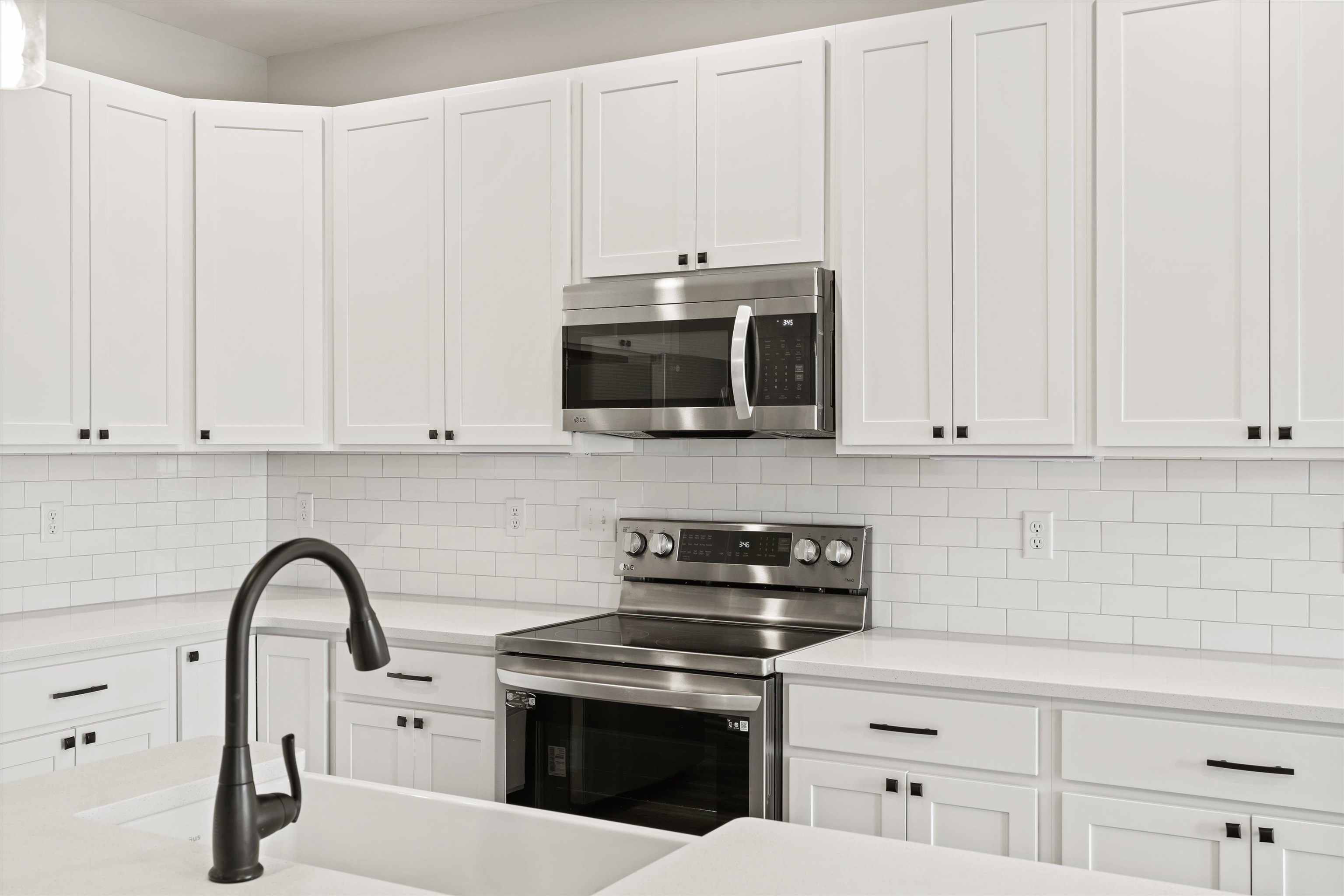 25 Barnyard Circle Bridgewater, VA 22812 - Photo 9 of 45 a kitchen with granite countertop white cabinets and stainless steel appliances