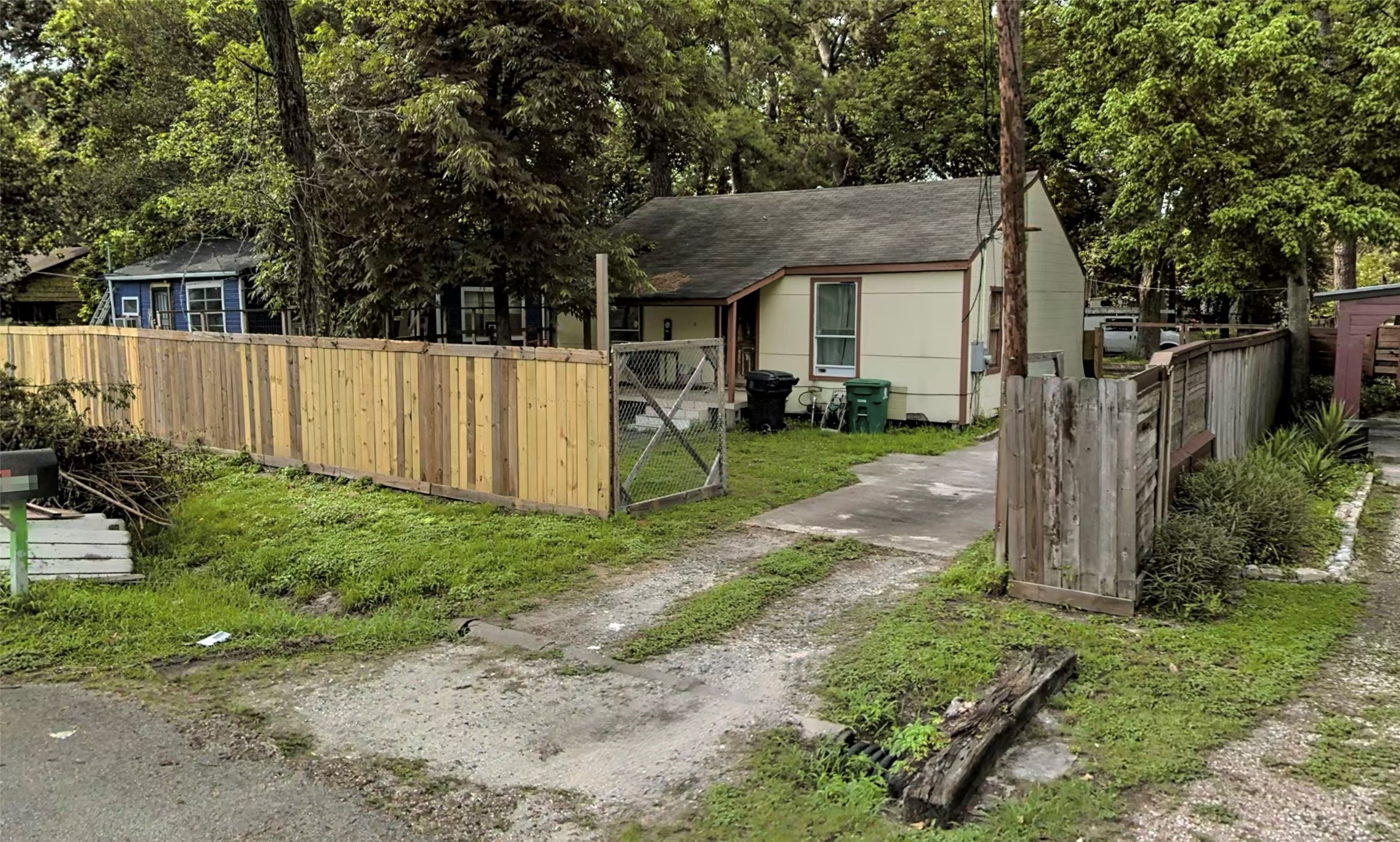 6911 Finch Street Houston, TX 77028 - Photo 5 of 9 a view of a house with a yard and large tree