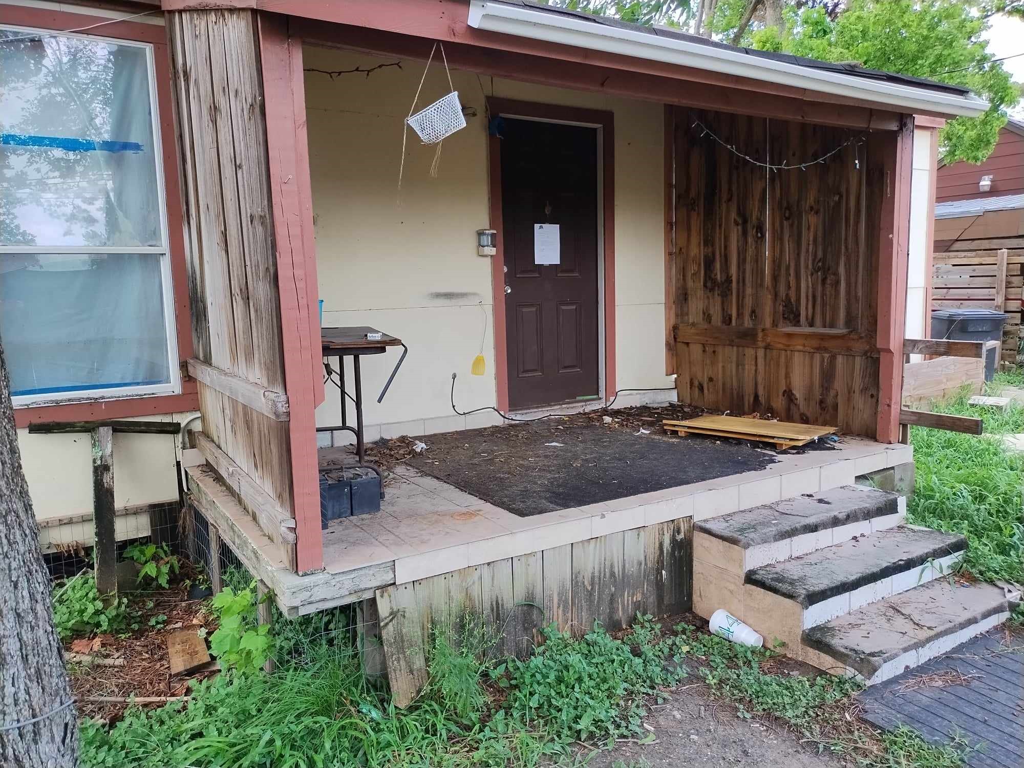 6911 Finch Street Houston, TX 77028 - Photo 8 of 9 a front view of a house with a yard