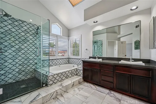 a spacious bedroom with a large bed and a window