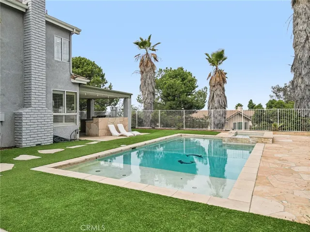a living room with furniture and a garden