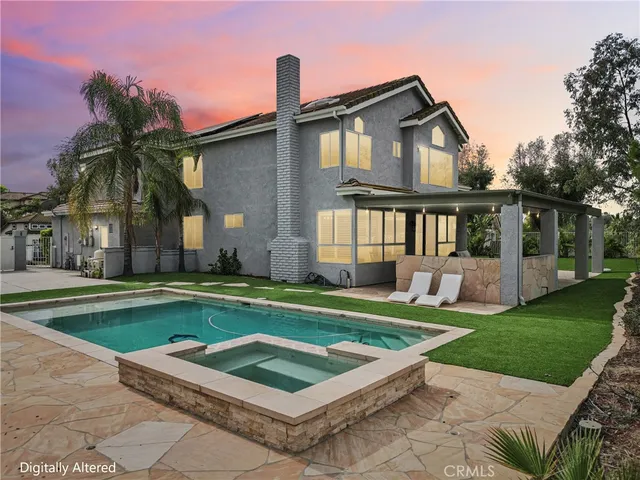 a front view of house with yard and outdoor seating