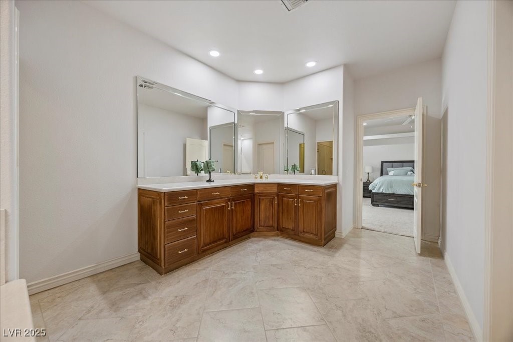 640 Quail Covey Road Henderson, NV 89002 - Photo 34 of 75 4th Bedroom bathroom with double vanity and recessed lighting and walk in marble shower