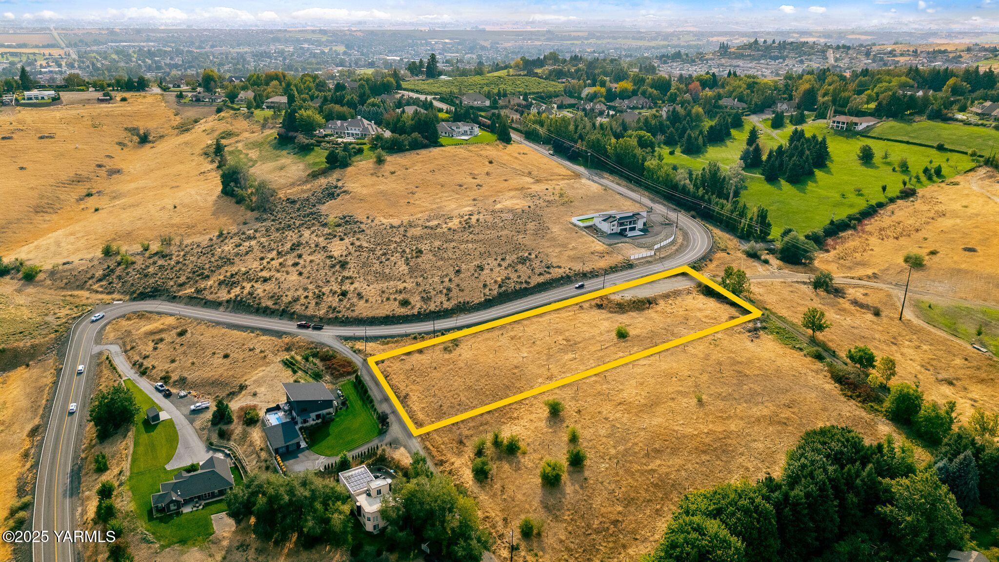 Nka Prospect Way Yakima, WA 98908 - Photo 7 of 10 an aerial view of a house with a yard and lake view