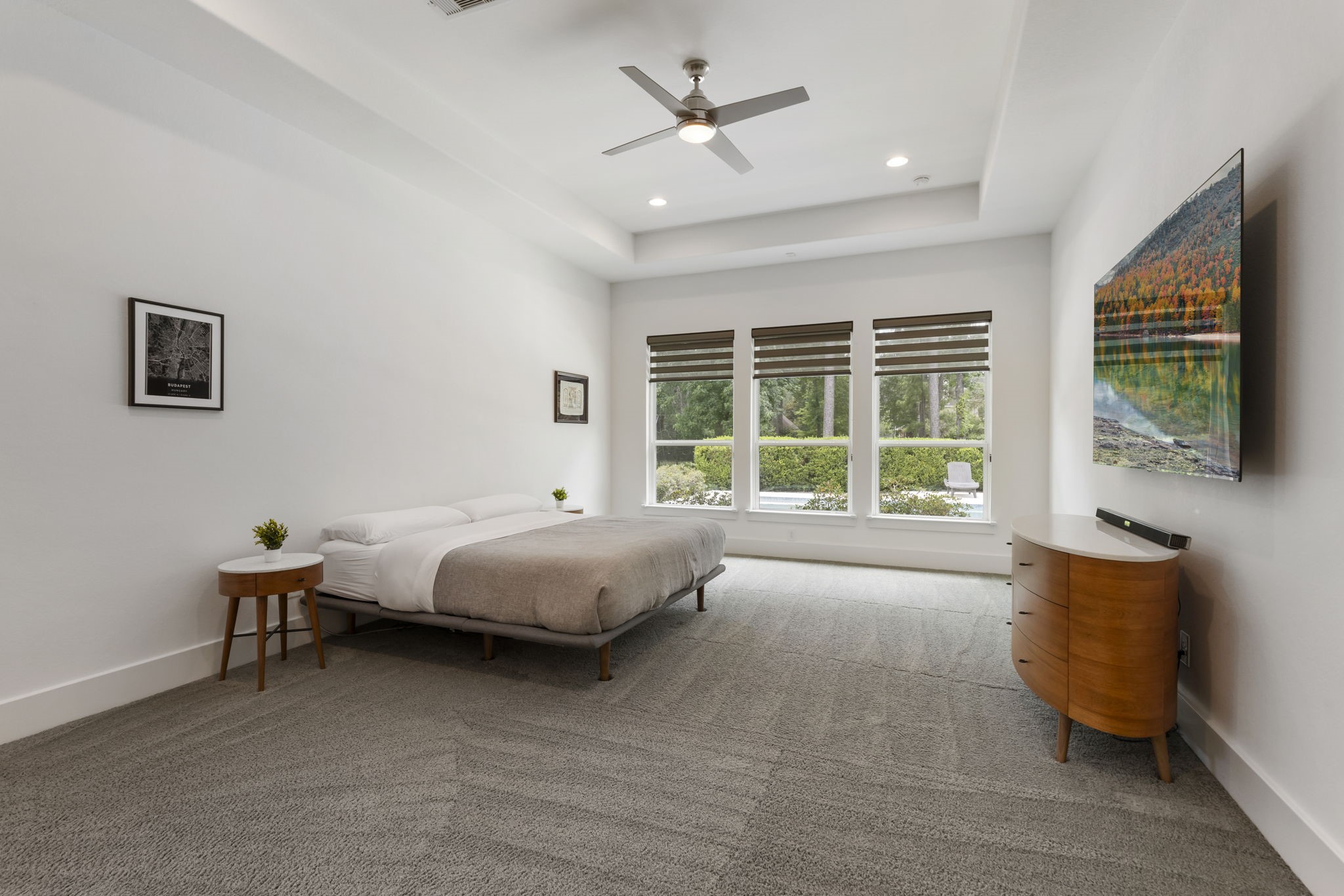 3918 Almond Court Spring, TX 77386 - Photo 18 of 42 a spacious bedroom with a bed and a large window
