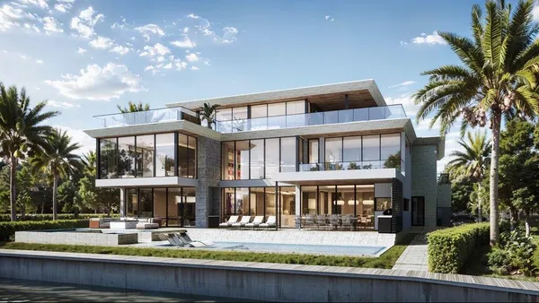 a front view of residential houses with yard and trees