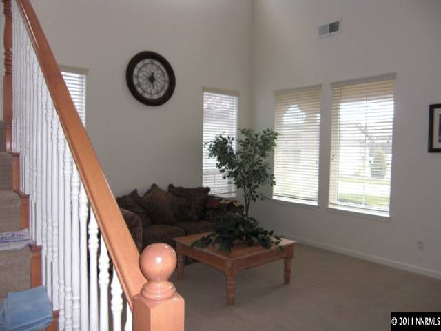 14044 Tagor Road Reno, NV 89521 - Photo 5 of 12 a front view of a house with garden