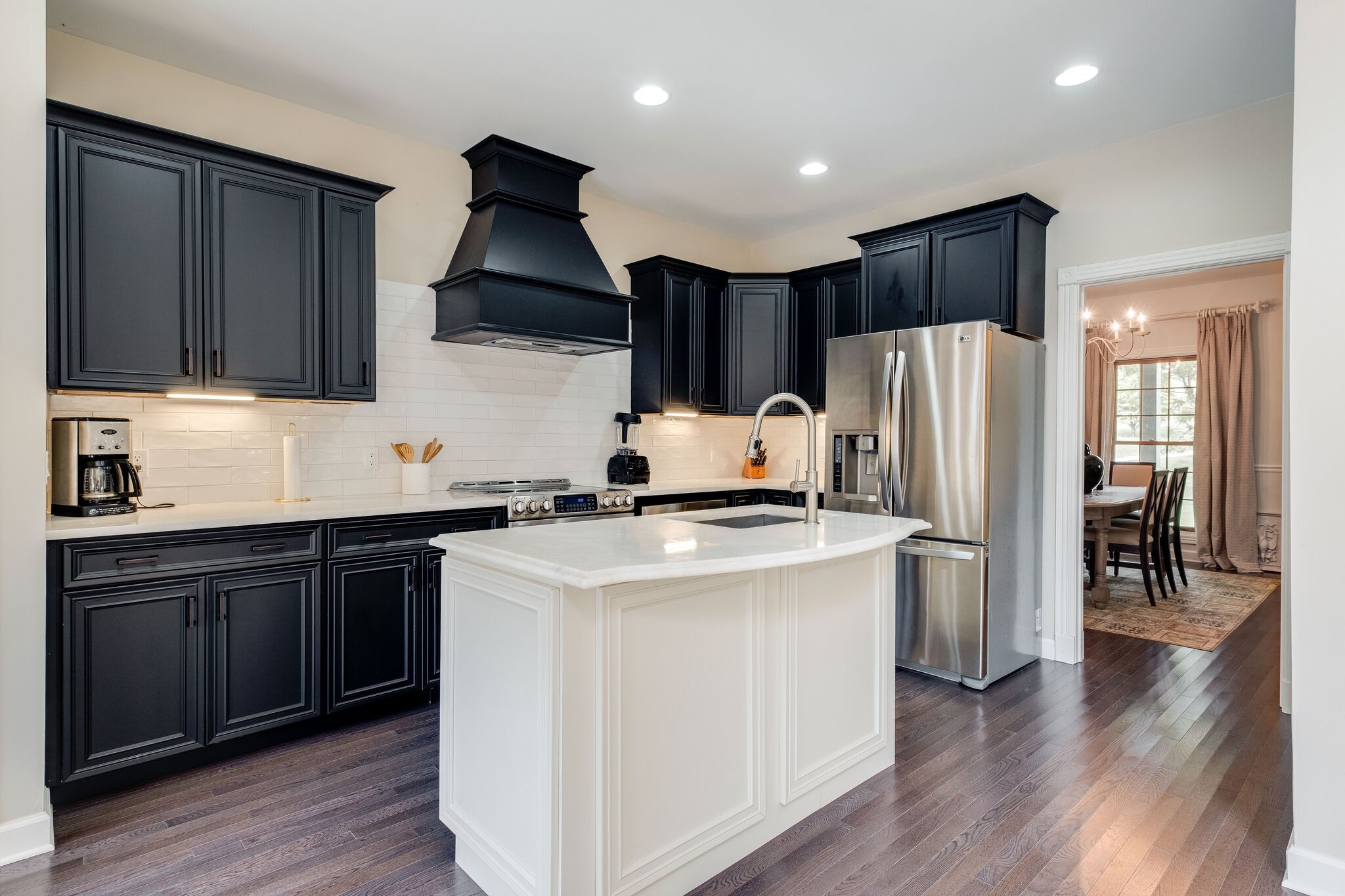 1177 Palmer Road Lebanon, TN 37090 - Photo 8 of 29 a kitchen with a refrigerator a stove top oven a sink and cabinets