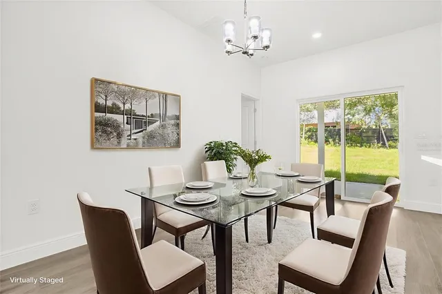 a view of a dining room with furniture window and outside view