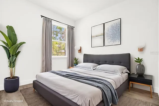 a view of a room with wooden floor