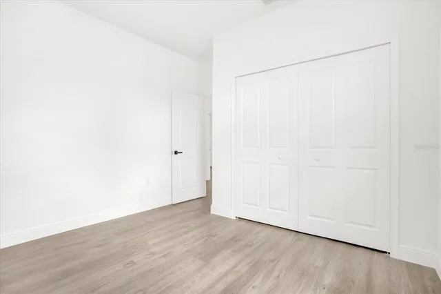 a view of a chairs and table in patio with a yard