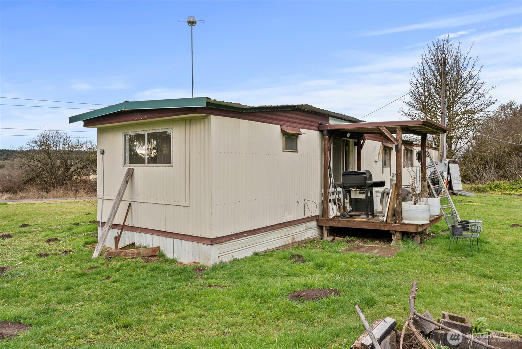 535-543 Knowles Road Winlock, WA 98596 - Photo 29 of 32 a small white house with a big yard and large trees