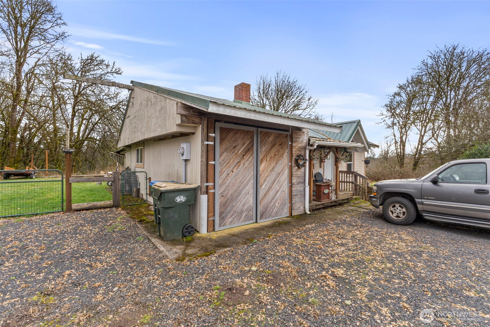 535-543 Knowles Road Winlock, WA 98596 - Photo 8 of 32 a view of a house with a yard and garage
