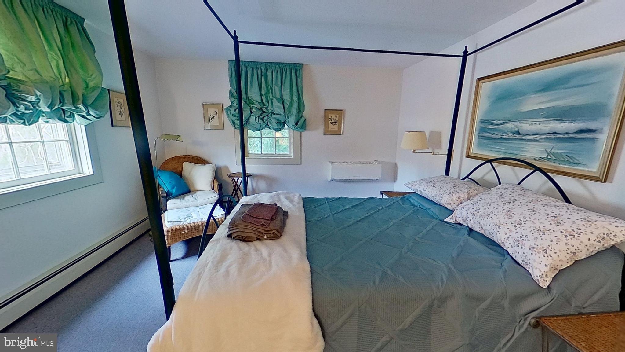 11525 High Point Road Felton, PA 17322 - Photo 2 of 5 a bedroom with a bed a lamp and a large window