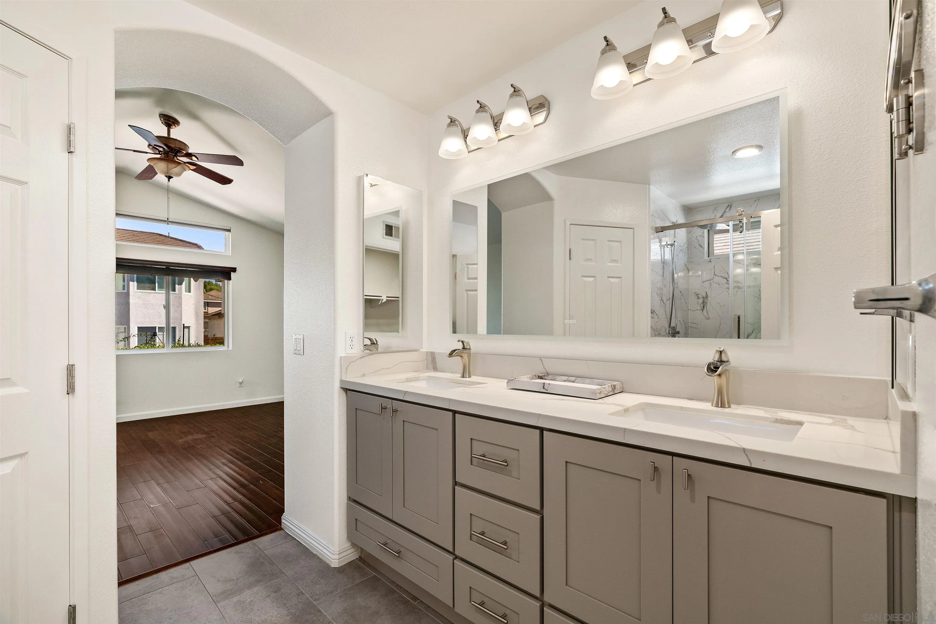 11338 Village Ridge Road San Diego, CA 92131 - Photo 10 of 15 a en suite bathroom with double sink and a mirror