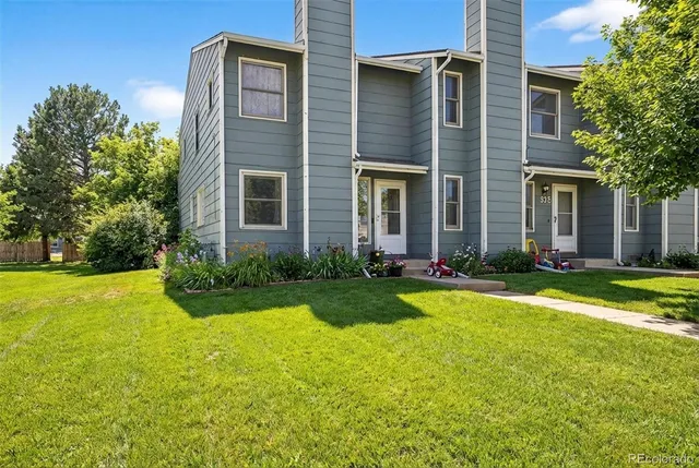 a view of a house with pool and garden