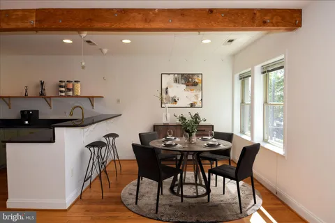a view of a dining room with furniture and window