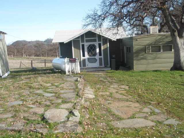 8768 Big Foot Road Igo, CA 96047 - Photo 19 of 41 a view of a house with a yard