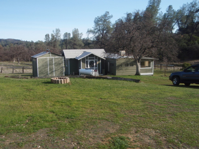 8768 Big Foot Road Igo, CA 96047 - Photo 22 of 41 a front view of a house with garden