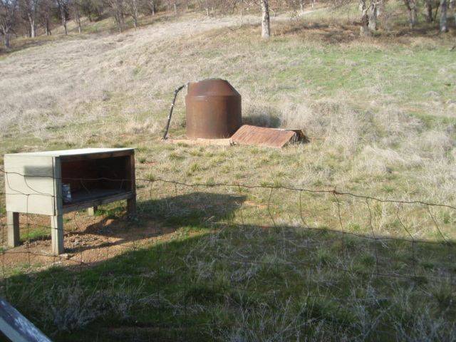 8768 Big Foot Road Igo, CA 96047 - Photo 24 of 41 a view of a bench in middle of the green field