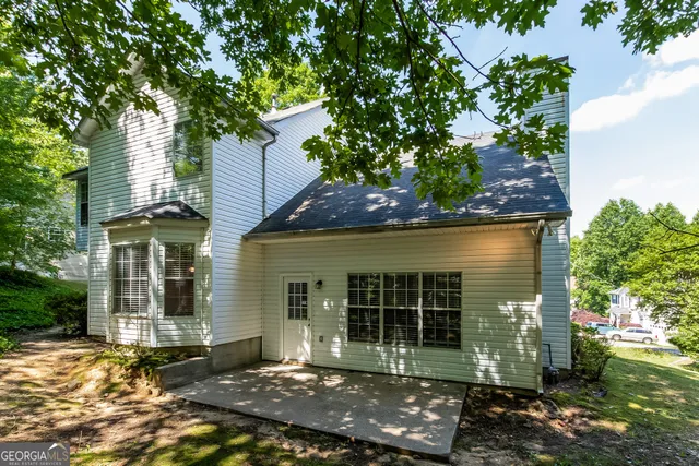 front view of a house with a tree
