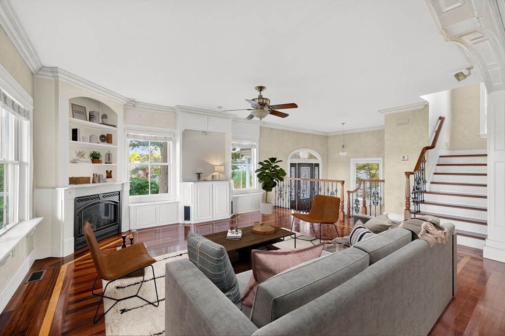 12 Quentin Street Milton, MA 02186 - Photo 13 of 41 a living room with furniture fireplace and a large window