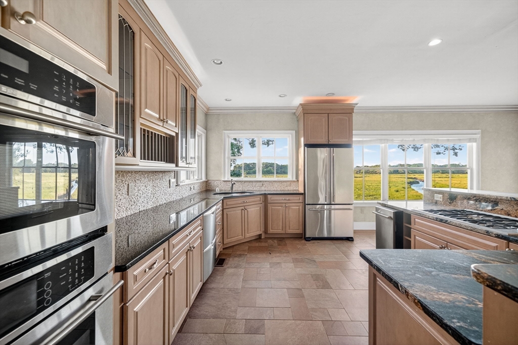 12 Quentin Street Milton, MA 02186 - Photo 20 of 41 a kitchen with a stove a sink and a refrigerator