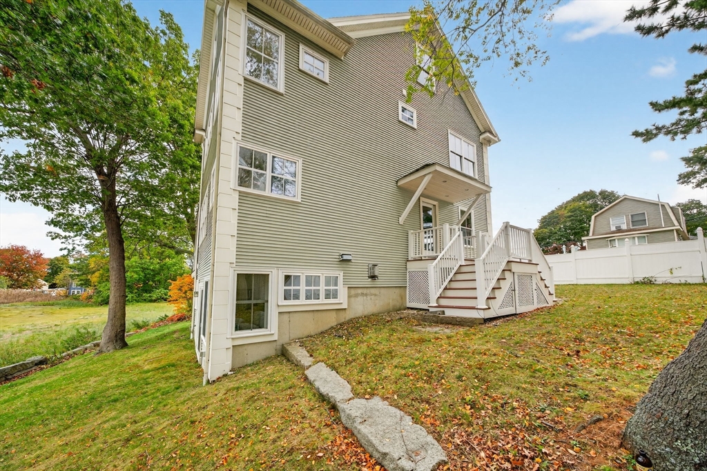 12 Quentin Street Milton, MA 02186 - Photo 2 of 41 a front view of a house with a yard