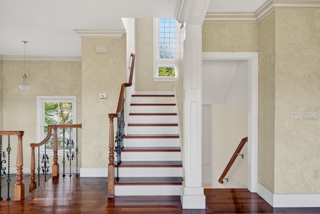12 Quentin Street Milton, MA 02186 - Photo 23 of 41 a view of entryway with wooden floor and stairs