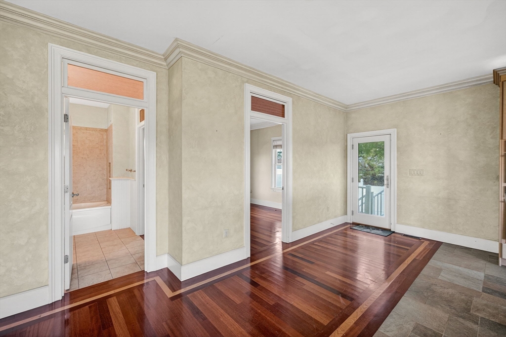 12 Quentin Street Milton, MA 02186 - Photo 24 of 41 wooden floor with white walls