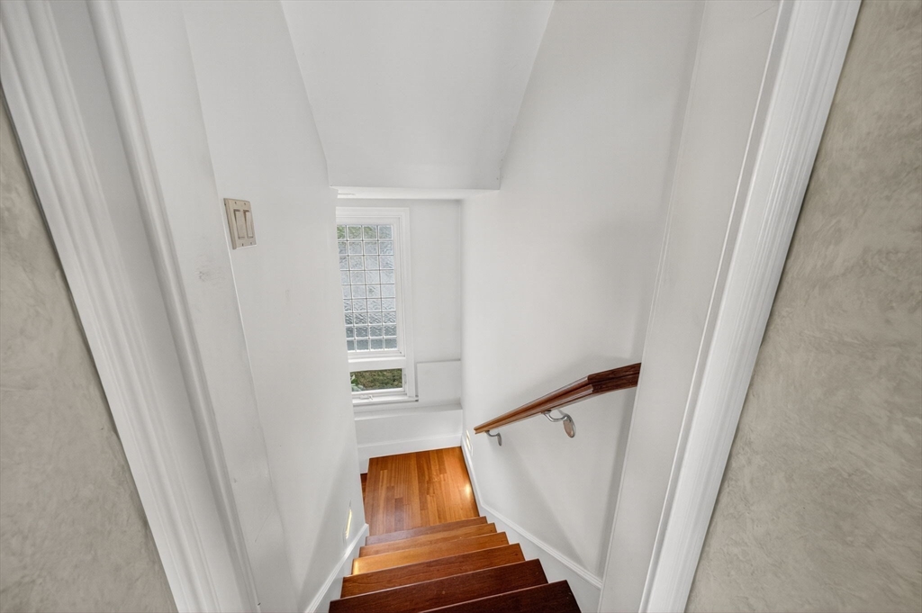 12 Quentin Street Milton, MA 02186 - Photo 30 of 41 a view of stairs with wooden floor