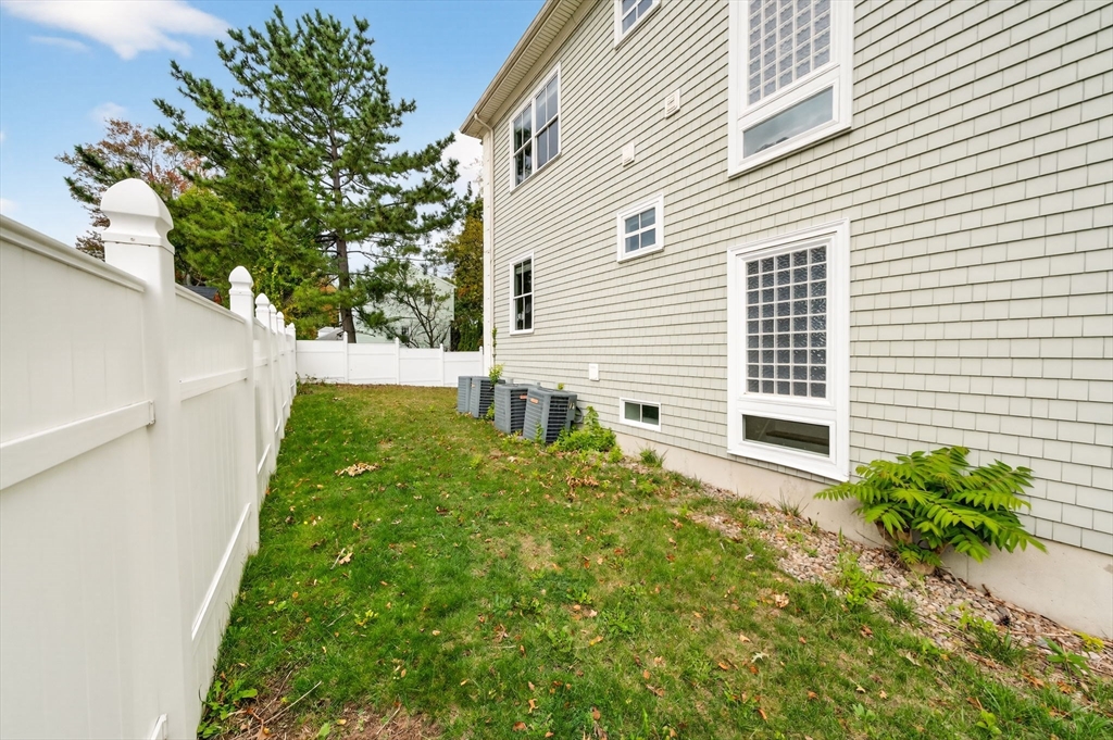 12 Quentin Street Milton, MA 02186 - Photo 3 of 41 a house view with a backyard space