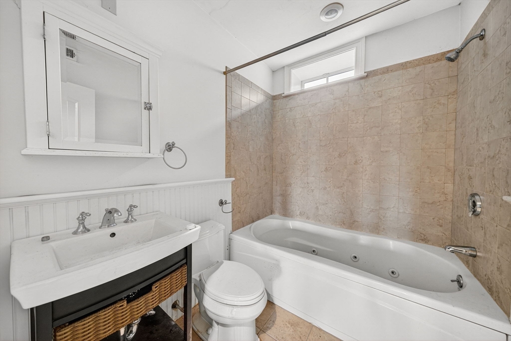 12 Quentin Street Milton, MA 02186 - Photo 31 of 41 a bathroom with a sink a toilet and a bathtub