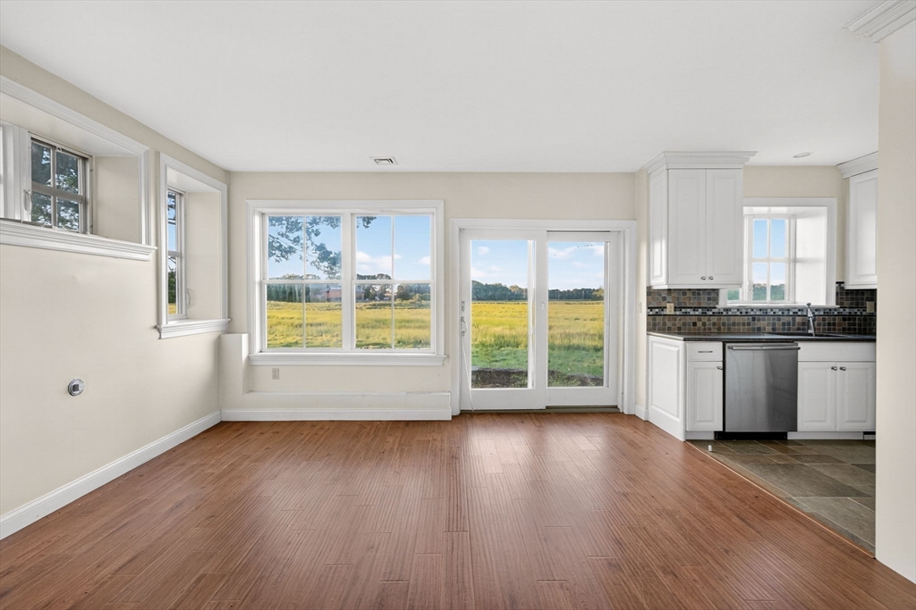 12 Quentin Street Milton, MA 02186 - Photo 37 of 41 a view of a kitchen with wooden floor and a window