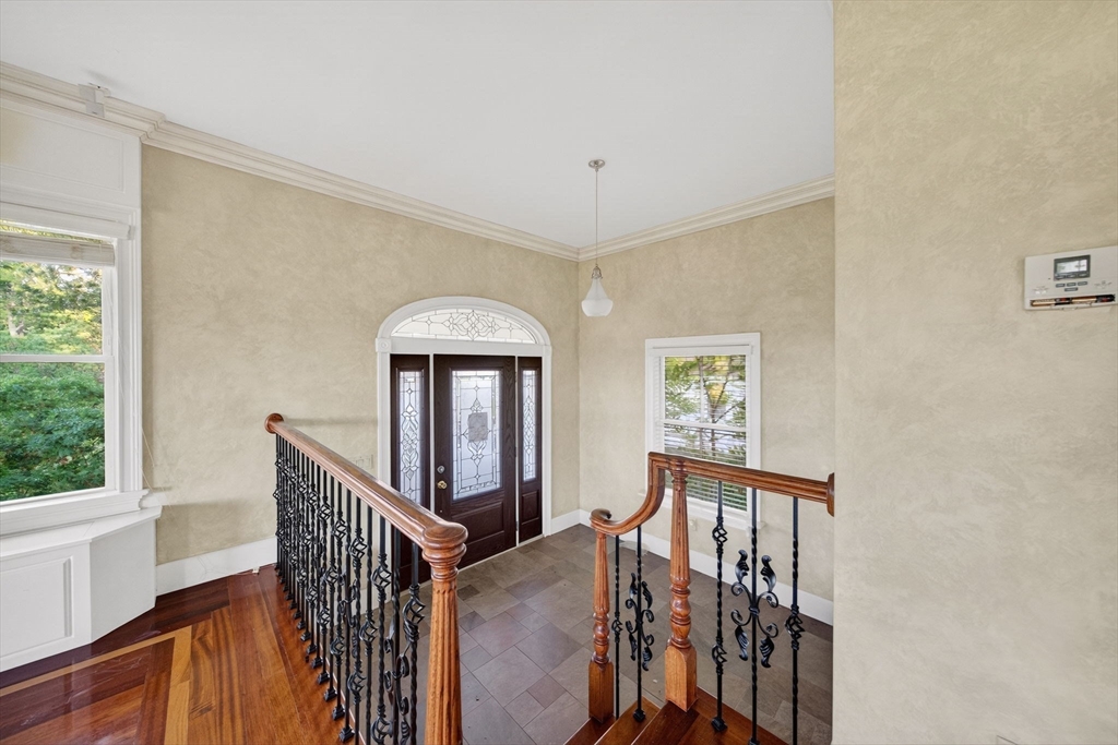12 Quentin Street Milton, MA 02186 - Photo 8 of 41 a view of entryway and hall with wooden floor