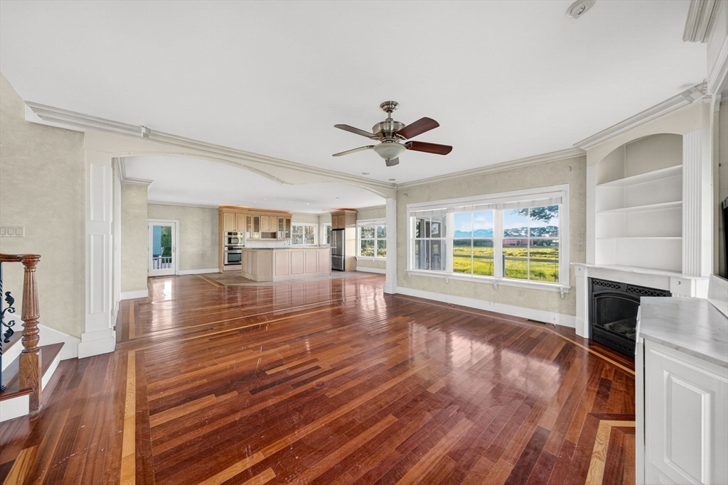 12 Quentin Street Milton, MA 02186 - Photo 10 of 41 a view of an empty room with wooden floor and a window