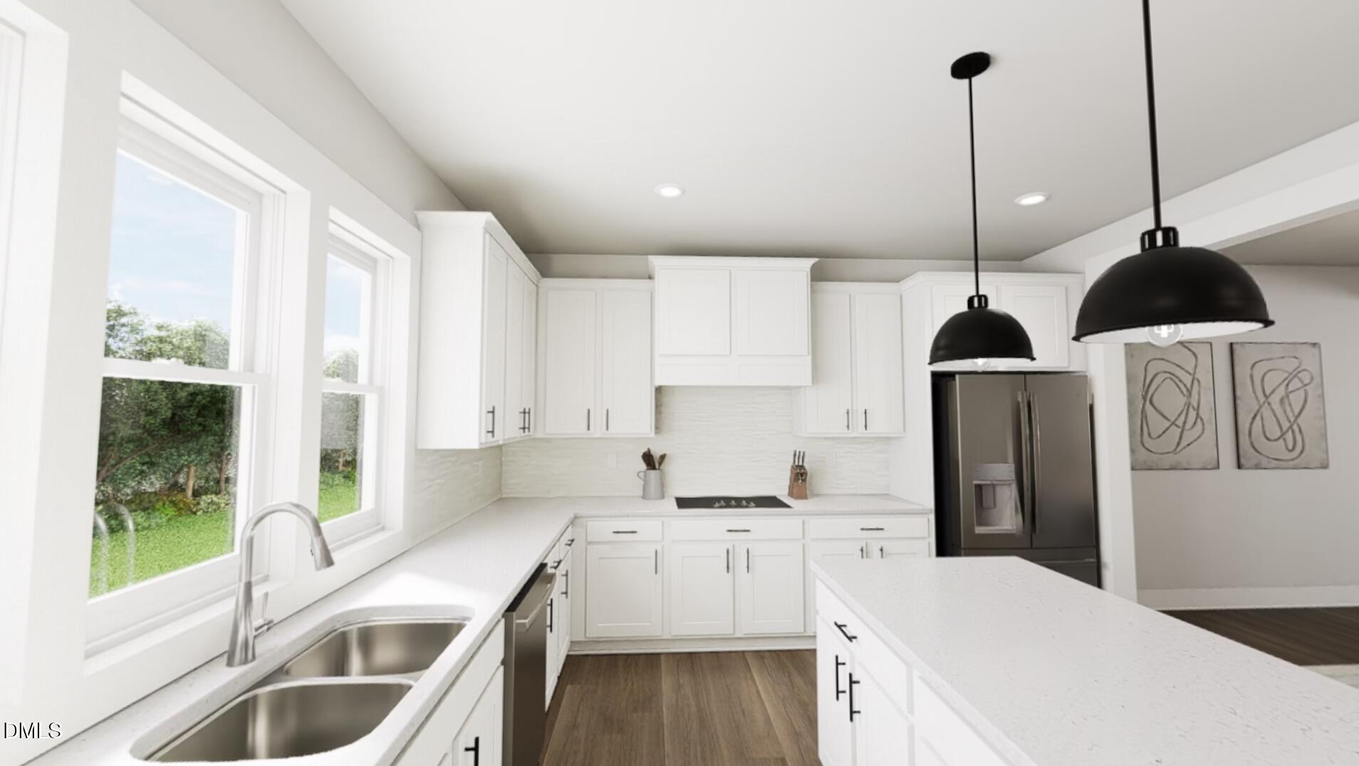 1163 Lamplighter Drive Raleigh, NC 27604 - Photo 3 of 24 a kitchen with a sink a counter top space stainless steel appliances a window and cabinets