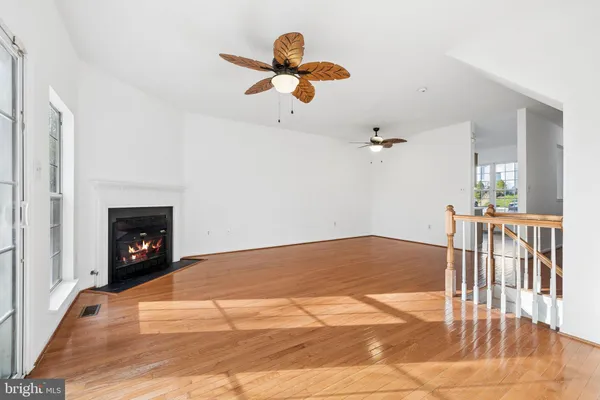 a view of a room with wooden floor
