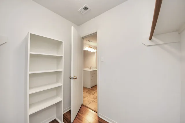 a bathroom with a sink a vanity and a mirror