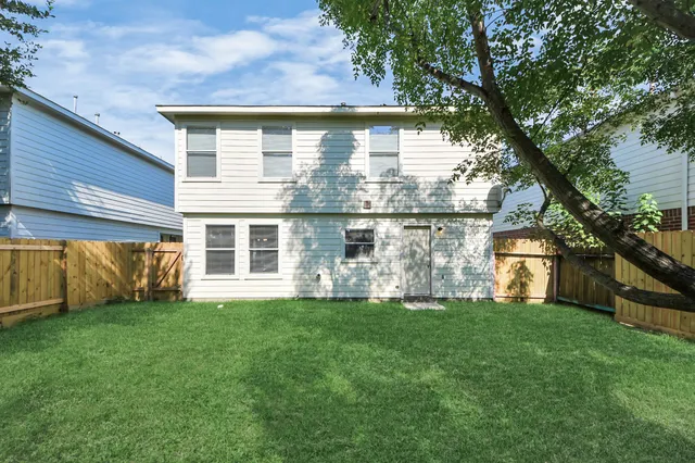 a view of a back yard of the house